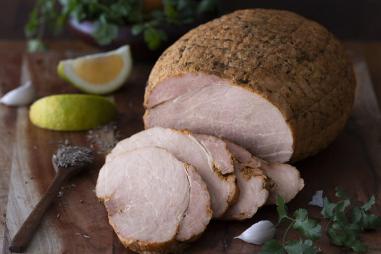 Sliced cuban roast pork on board